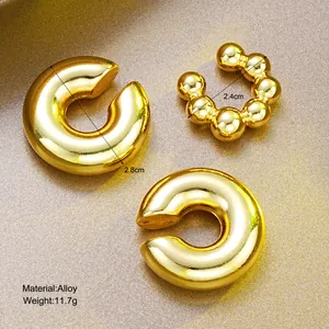 Three-piece gold alloy C-shape ear cuff set with smooth finish and beaded texture