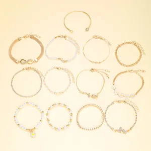 13-piece gold fashion bracelet set featuring pearls, daisies, and infinity charms