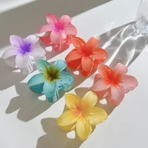 Set of six colorful 7cm plumeria flower hair claws with translucent resin finish for women
