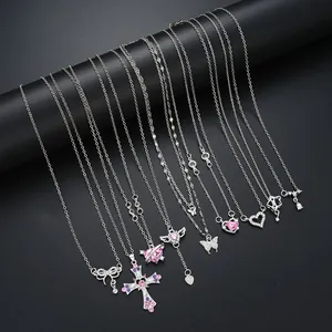 Set of 9 silver necklaces featuring crystal cross, heart wings and bow pendants