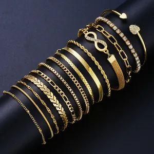 Close-up of 14-piece gold chain bracelet set with infinity symbol and rhinestone details