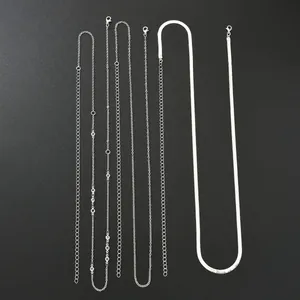Minimalist silver-toned double layer snake chain and cross tassel body chain set
