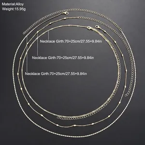 Three-layer gold sequin and pearl body chain with sizing and material specifications