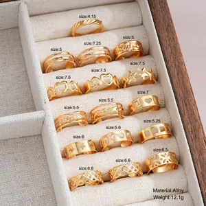 13pcs gold-toned minimalist ring set featuring heart and star cutouts on jewelry box