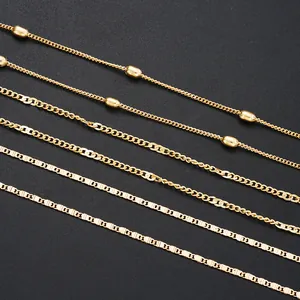 Minimalist gold multi-layer chain belts with pearls and sequins shown on a black background