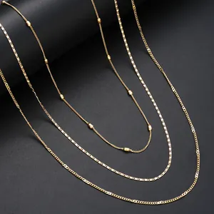 Minimalist layered gold waist chain set with flat sequin link and satellite bead charms