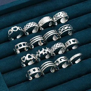 Detailed view of silver toe ring set with heart and star patterns in velvet gift box