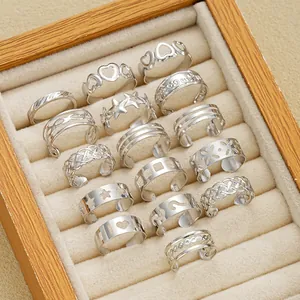 Detailed view of a 15-piece silver adjustable toe ring set with hearts and stars