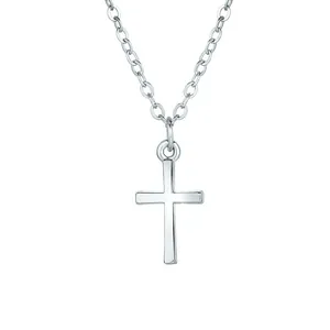 Detailed view of a minimalist polished silver cross pendant with a fine cable chain necklace