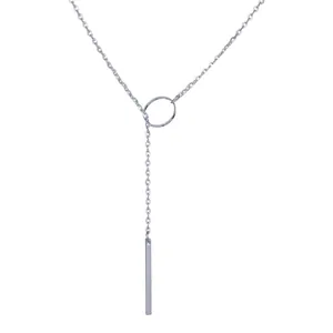 Detailed close-up of a silver Y-shaped lariat necklace with a circular ring and bar pendant