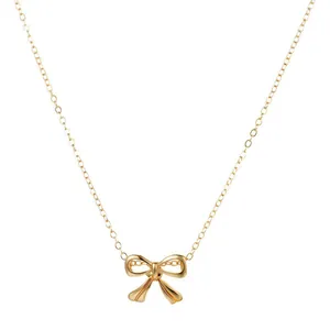 Elegant gold-tone bow pendant necklace with smooth minimalist finish for women