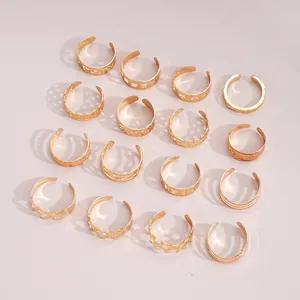 Detailed grid of 16 gold adjustable rings featuring star and heart patterns on pink background