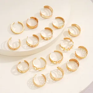 Macro detail of 15-piece gold adjustable toe rings with star and heart hollow patterns