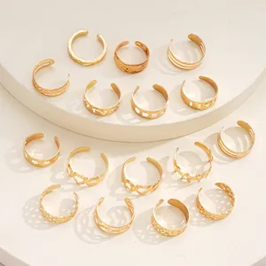 Detailed view of 16-piece gold adjustable toe rings set with hollow star and heart designs