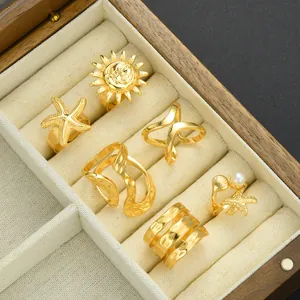 Goldenes 6er-Ring-Set mit Sonnenmotiven, Seesternen, Perlen und geometrischen Wellendesigns