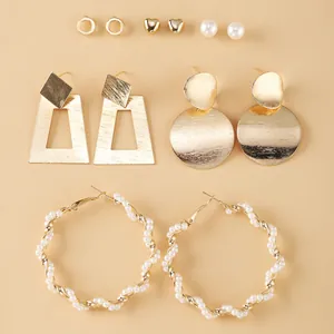 Detail of 6-pair gold alloy earring set with geometric shapes and faux pearls