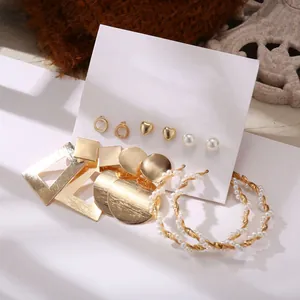 Detailed set of 5 pairs of gold alloy earrings with pearls and geometric shapes