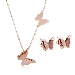 Elegant rose gold butterfly jewelry set with frosted necklace and matching stud earrings