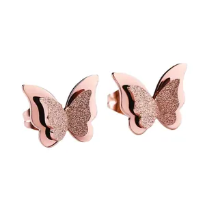 Elegant rose gold butterfly earrings with layered mirror finish and frosted wings