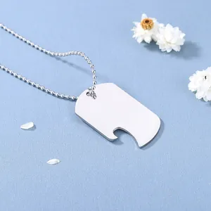 Polished stainless steel dog tag necklace with bottle opener pendant on blue background