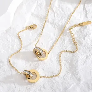Parure de bijoux en titane doré avec chiffres romains et anneaux entrelacés