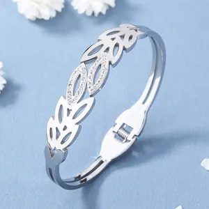 Bracelet ajouré en acier inoxydable argenté avec motifs de feuilles et zircons