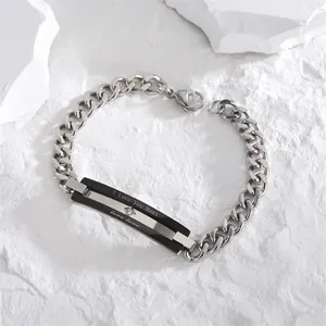 Detail of couple's bracelet with 'I Love You Most' engraving and sparkling zircon