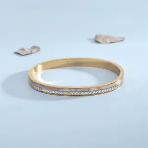 Bracciale rigido in acciaio oro rosa con intarsio in madreperla e cristalli lucidi