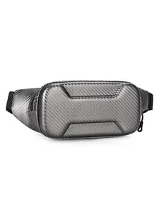 Detail of hardshell motorcycling chest bag with silver carbon fiber texture finish