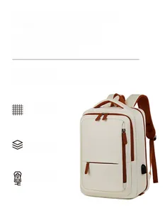 Close-up of cream business travel backpack showing lateral USB charging port and brown accents