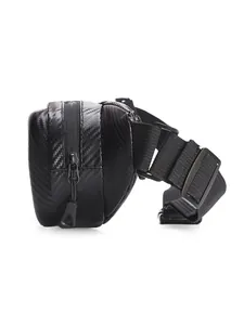 Detail view of the black motorcycle chest bag showing carbon fiber texture and zipper