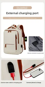 Detail of travel backpack featuring external USB charging port and internal power bank pocket