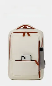 Detail of travel backpack showing side USB port and phone storage compartment