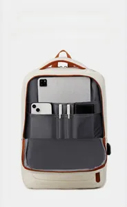 Detail of multi-pocket front compartment for tablet and power bank with USB port