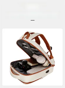 High-capacity travel backpack showing internal compartments for laptop and camera gear
