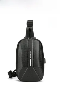 Close-up of black hard shell chest bag featuring carbon fiber texture and fashion logo