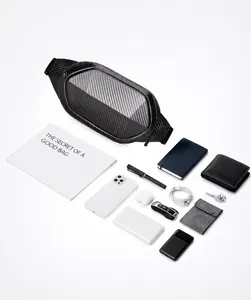 Flat lay of hard shell crossbody bag showing large storage capacity for tech accessories