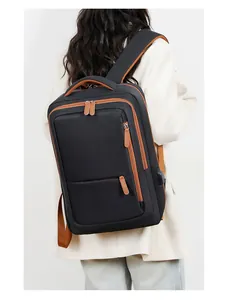 Detail of travel backpack showing side USB port and durable water-resistant fabric