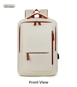 Detail of a cream travel backpack showing external USB charging port and brown zippers