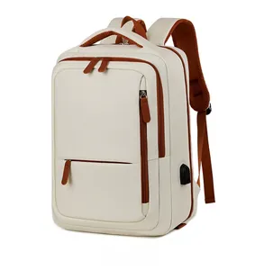 Detailed side view of beige travel backpack featuring integrated external USB charging port