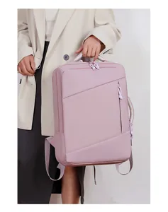 Pink waterproof travel backpack with side handle and diagonal zipper pocket for laptop