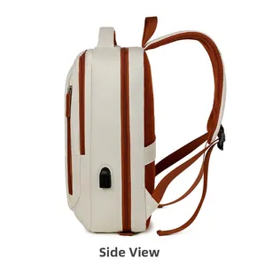 Side view of white travel backpack with orange zippers and external USB charging port