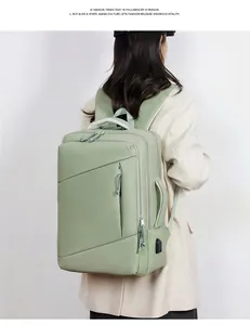 Light green travel backpack featuring side USB charging port and geometric zipper design