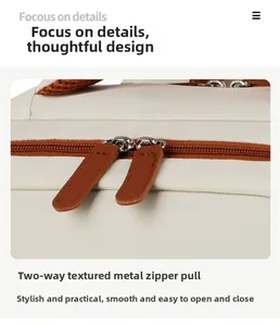 Detail view of smooth two-way metal zippers with premium brown faux leather pulls