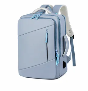 Blue travel backpack detail showing side handle and external USB charging port