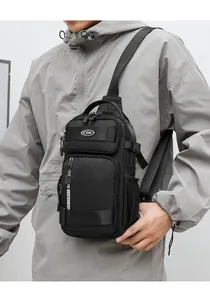 Macro shot of waterproof black Oxford chest bag showing durable texture and multi-zipper pockets