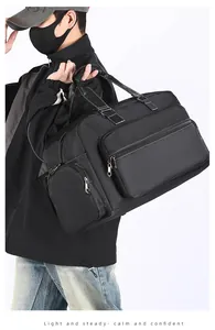 Detail der schwarzen Reisetasche mit weißen Nähten, Reißverschlussfach und Nylonmaterial