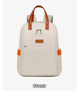 Front view of beige canvas backpack featuring brown leather handles and orange side pocket accents