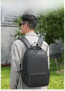 Waterproof black laptop backpack for men featuring minimalist design and side bottle pocket