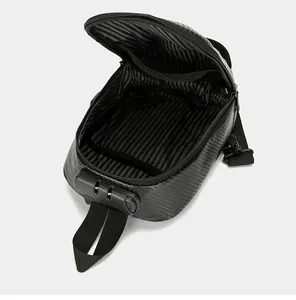 Detail view of anti-theft carbon fiber sling bag showing internal storage and combination lock